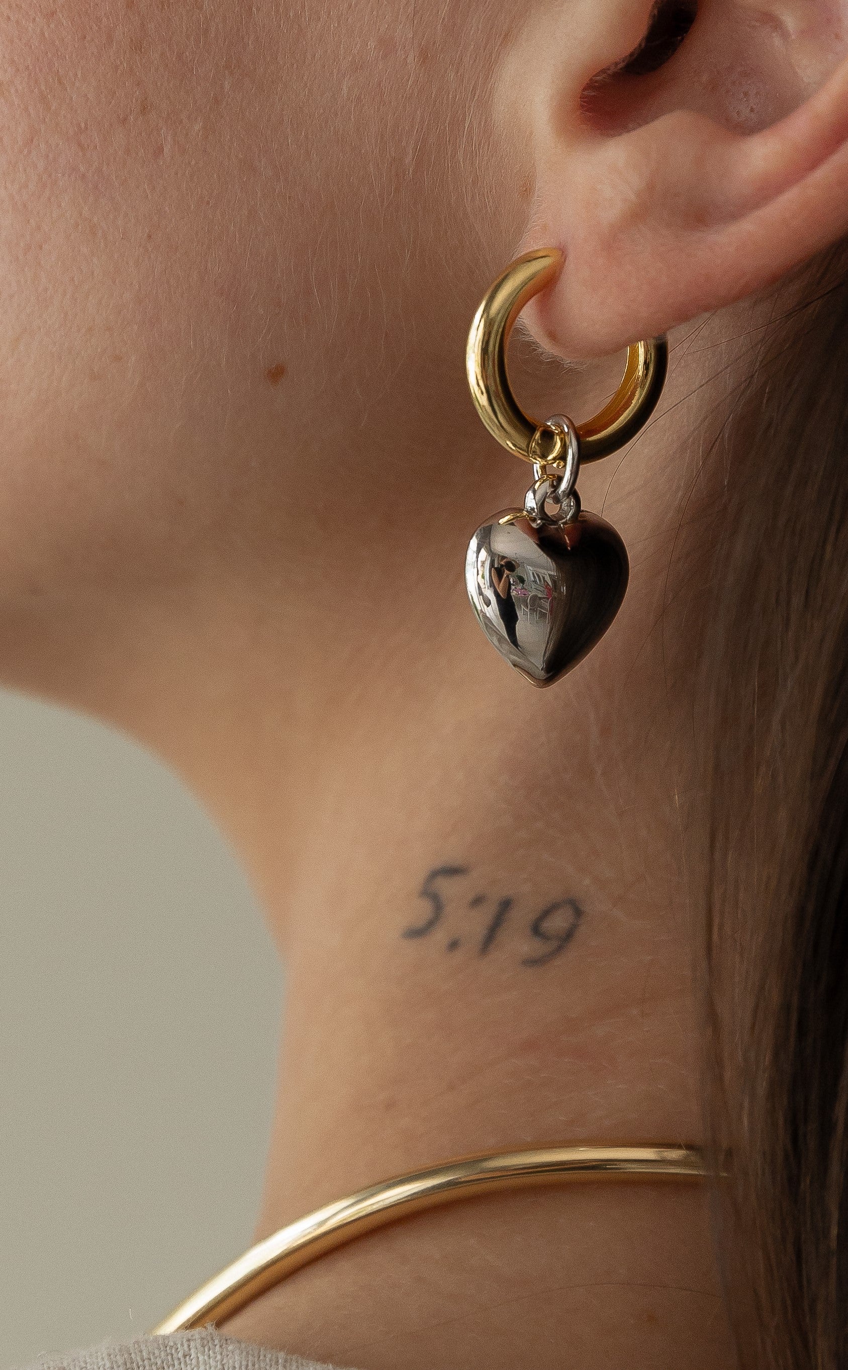 mixed metal small hoop with heart pendant