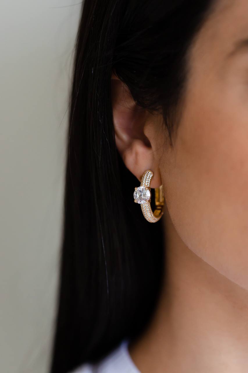 Elevate your jewelry collection with our Maxi Zirconia Studded Hoop Earrings, a perfect blend of classic elegance and modern sophistication. 