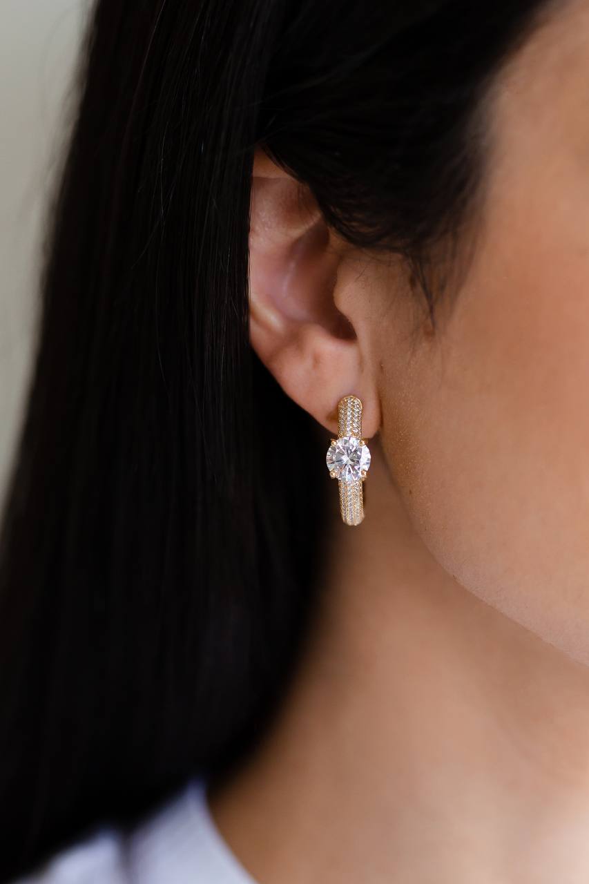 Elevate your jewelry collection with our Maxi Zirconia Studded Hoop Earrings, a perfect blend of classic elegance and modern sophistication. 